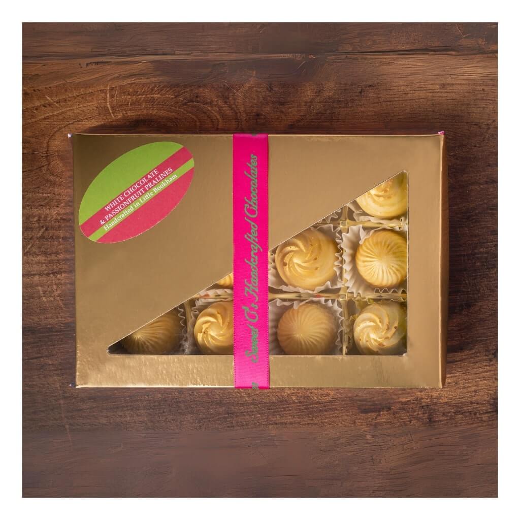 
                  
                    Sweet C's White Chocolate & Passionfruit Pralines in a box
                  
                