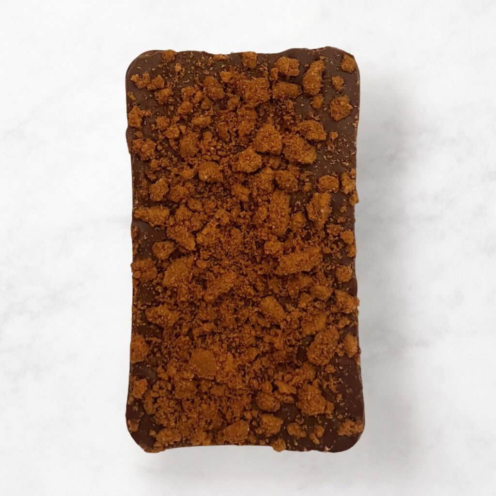 
                  
                    Chocolate bar with a crumbly Biscoff topping on a white from Sweet C'sbackground
                  
                