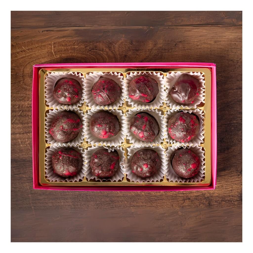 
                  
                    Sweet C's Dark Chocolate Raspberry Truffles in open box
                  
                