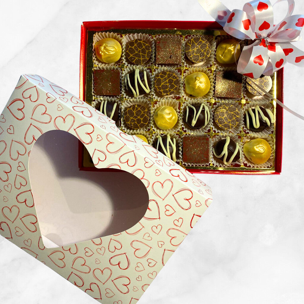 
                  
                    Box of Valentine's chocolates from Sweet C's Chocolates with a heart-shaped container on a white background
                  
                