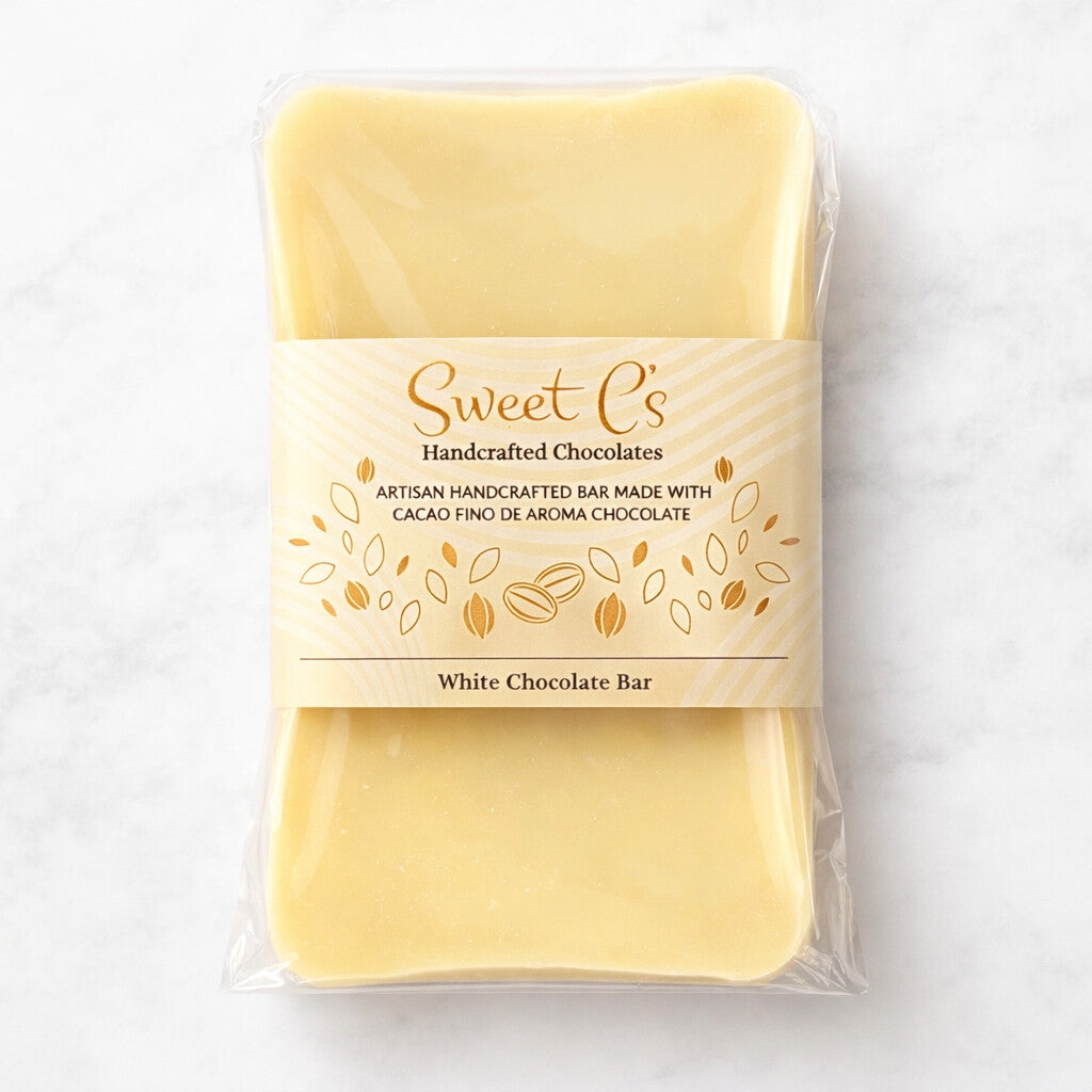 
                  
                    White chocolate bar in packaging with 'Sweet C's' branding on a light gray background.
                  
                